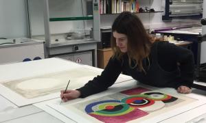 CMAS Archive Conservator Sarah Volter working on signed prints by Barbara Hepworth and Sonia Delauney